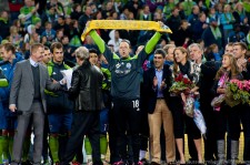 Kasey raises the Golden Scarf with players, family, and friends Claudio Reyna and Brian McBride