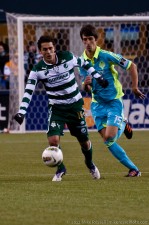 Alvaro Fernandez chases after Herculez Gomez